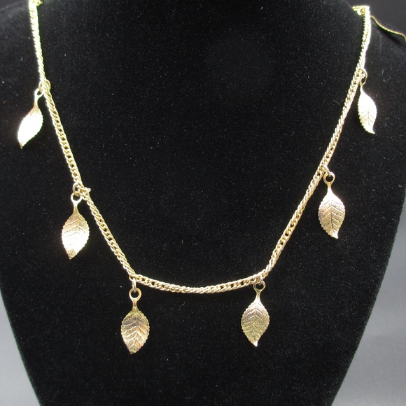 Jewelry - Gold Tone Stylish Golden Leafs Necklace Hangs 16"